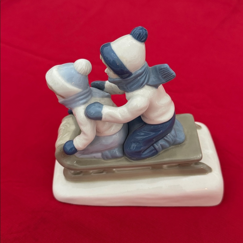 1992 vintage Porcelain Figurine of Children Sledding (OLCC)